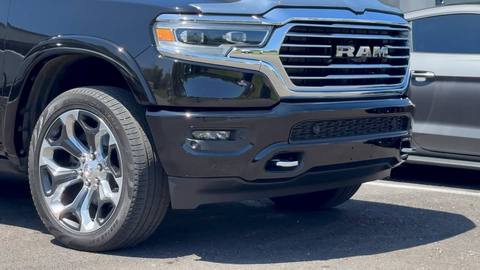 Front bumper and grille of a black RAM Longhorn pickup