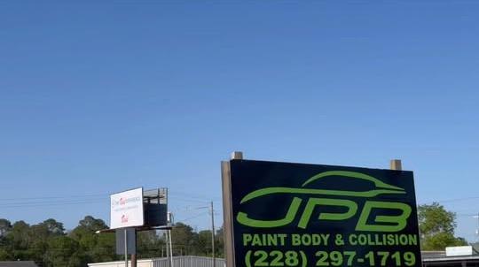 Roadside JPB Paint Body & Collision sign with the shop phone number