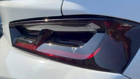 Close-up of a smoked taillight on a white car